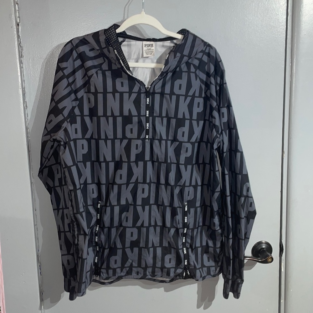 Selling a windbreaker. Has a little tear on it from dryer.